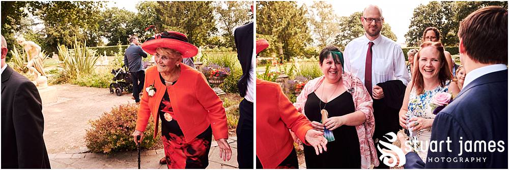 Fun candid photographs as the guests greet the new Mr & Mrs and enjoy the drinks reception on the lawns at Moxhull Hall in Sutton Coldfield by Moxhull Hall Wedding Photographer Stuart James