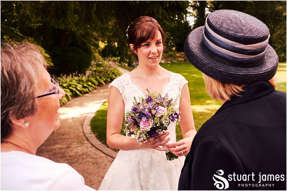 Fun candid photographs as the guests greet the new Mr & Mrs and enjoy the drinks reception on the lawns at Moxhull Hall in Sutton Coldfield by Moxhull Hall Wedding Photographer Stuart James