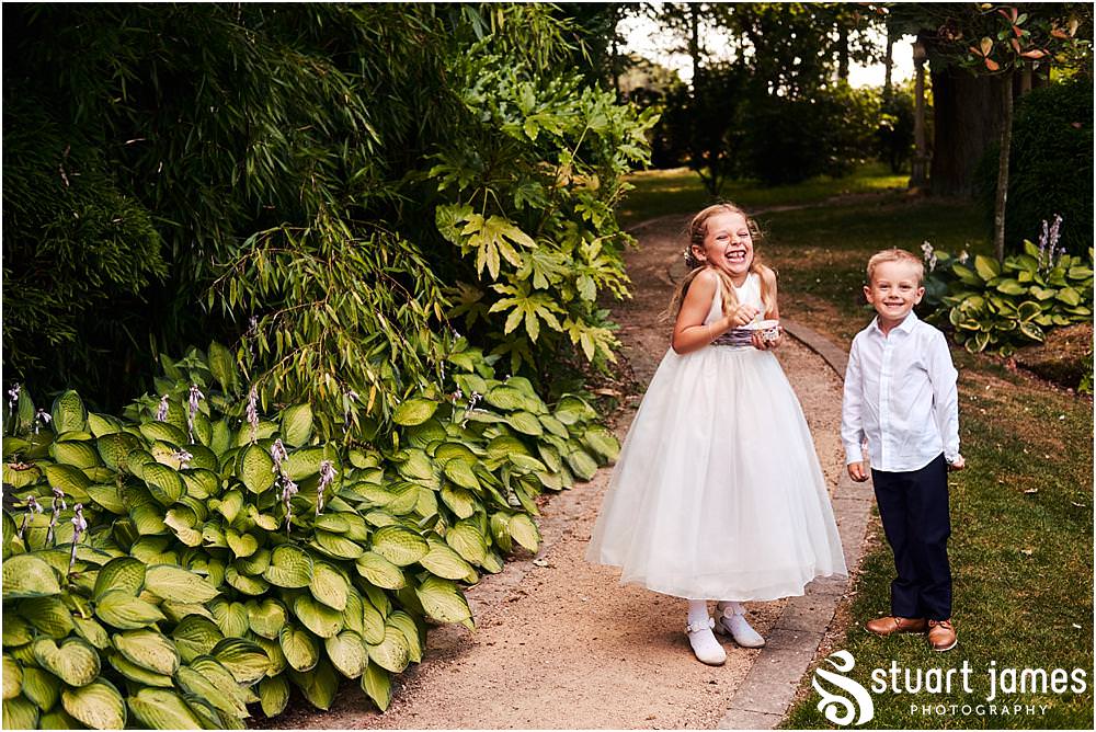 Fun candid photographs as the guests greet the new Mr & Mrs and enjoy the drinks reception on the lawns at Moxhull Hall in Sutton Coldfield by Moxhull Hall Wedding Photographer Stuart James