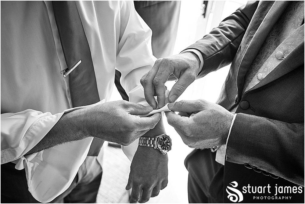Documenting the morning preparations for the grooms and groomsmen ahead of the wedding at St Austins Church by Stafford Wedding Photographers Stuart James