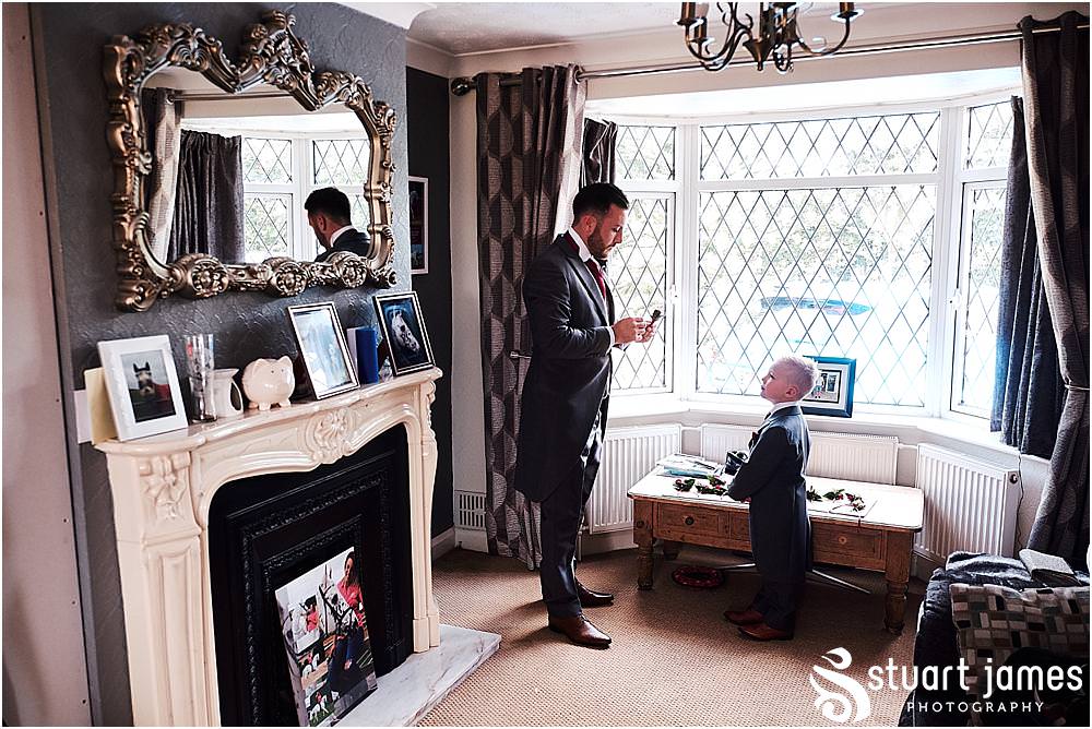 Documenting the morning preparations for the grooms and groomsmen ahead of the wedding at St Austins Church by Stafford Wedding Photographers Stuart James