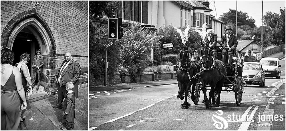 Travelling in style with a horse and carriage arrival for our bride at St Austins Church by Stafford Wedding Photographers Stuart James