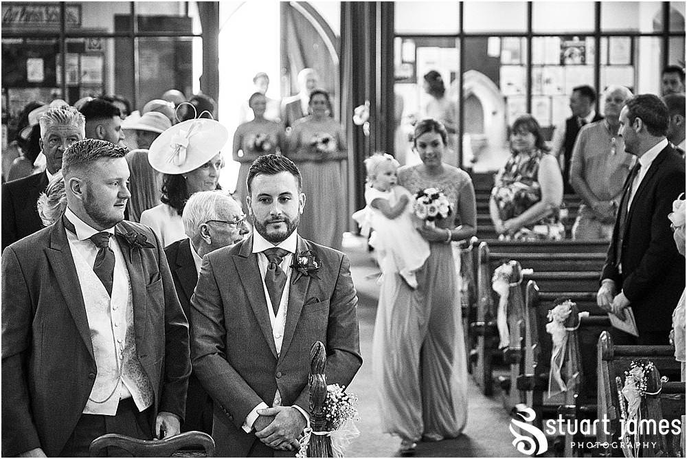 Such a beautiful moment to capture as the bridal party process into the wedding ceremony at St Austins Church by Stafford Wedding Photographers Stuart James