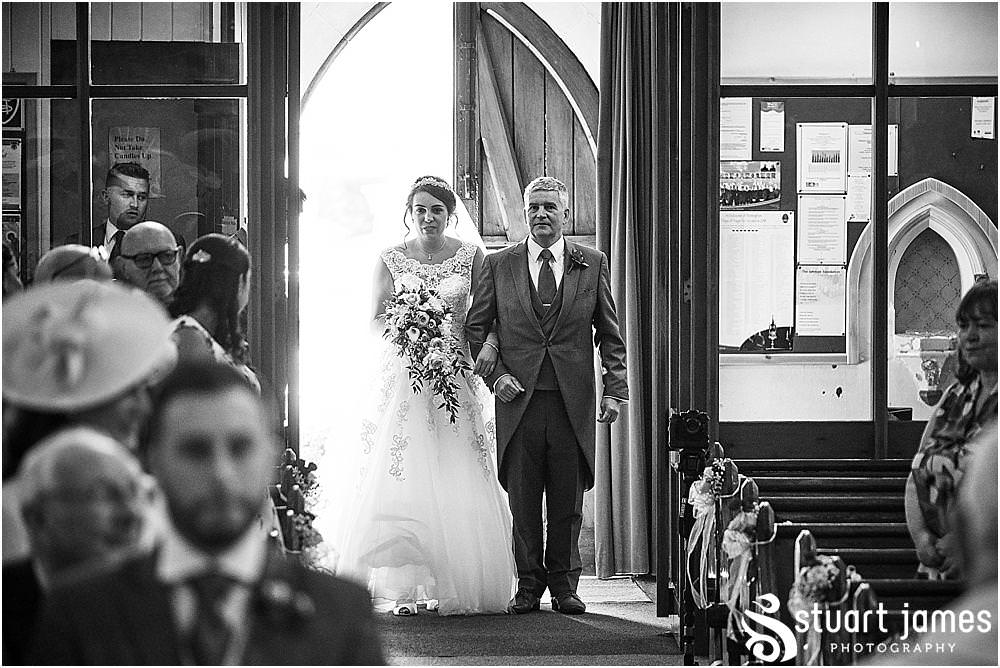Such a beautiful moment to capture as the bridal party process into the wedding ceremony at St Austins Church by Stafford Wedding Photographers Stuart James