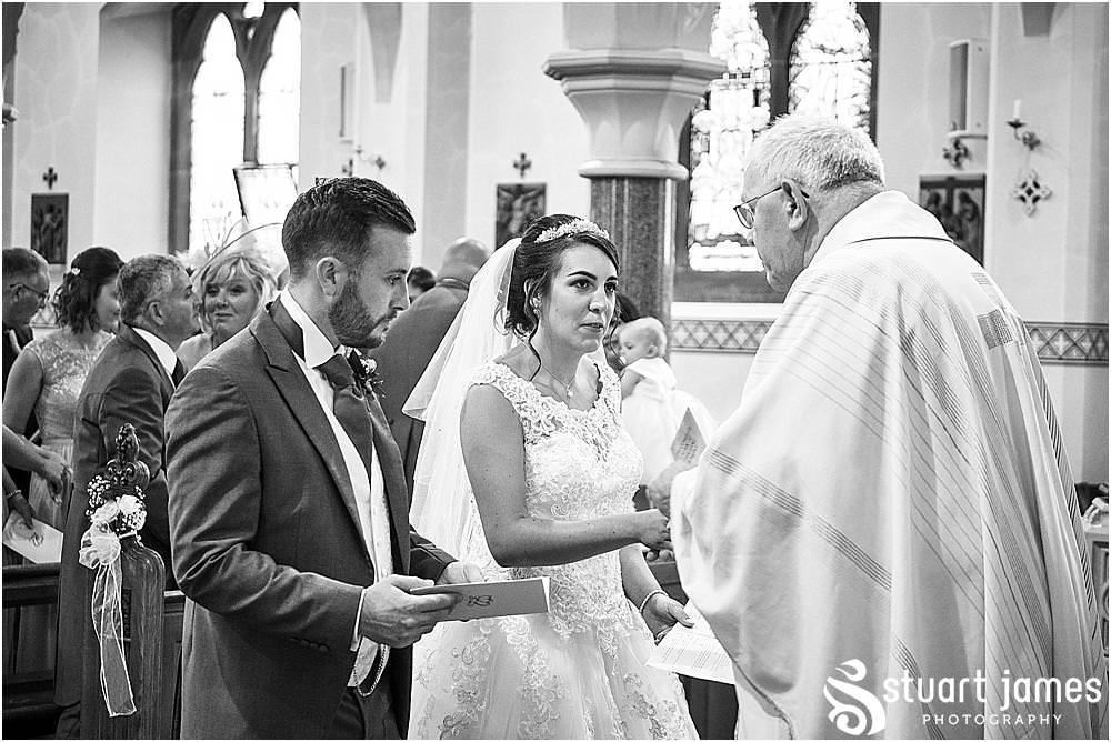 Unobtrusive photographs that capture every moment and emotion during the wedding ceremony at St Austins Church by Stafford Wedding Photographers Stuart James