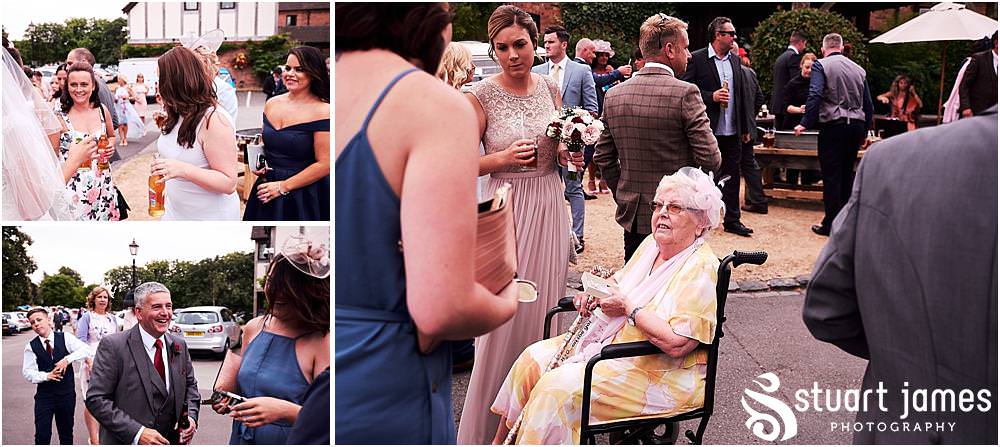 Capturing candid moments of the guests enjoying the fabulous setting for the wedding reception at The Moat House by Stafford Wedding Photographers Stuart James
