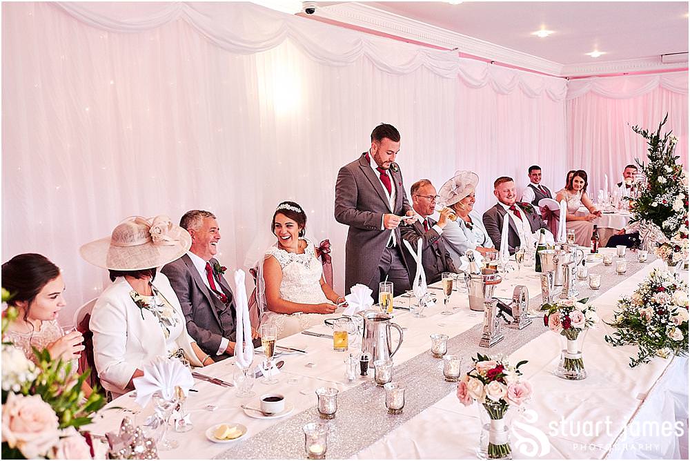 Capturing the wedding speeches and guest reactions as the grooms speech goes down a storm at The Moat House by Stafford Wedding Photographers Stuart James