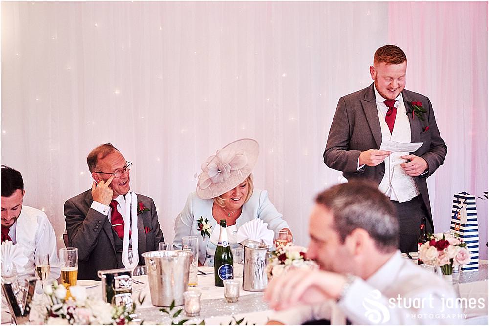 Fabulous reactions to capture as the best man's speech hits all the right spots at The Moat House by Stafford Wedding Photographers Stuart James