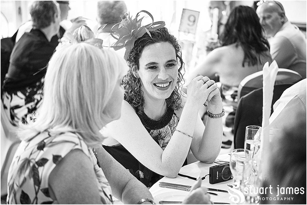 Creative candid photographs as the guests enjoy the wedding breakfast at The Moat House by Stafford Wedding Photographers Stuart James