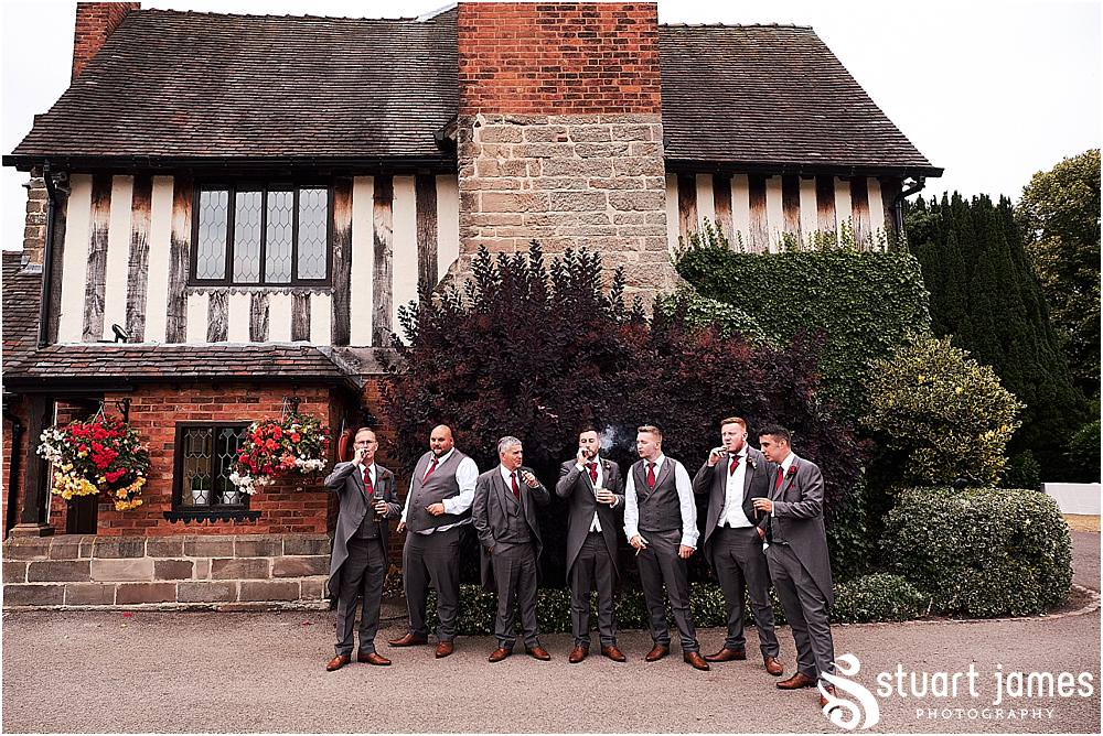 Cigar fun with the wedding party at The Moat House by Stafford Wedding Photographers Stuart James