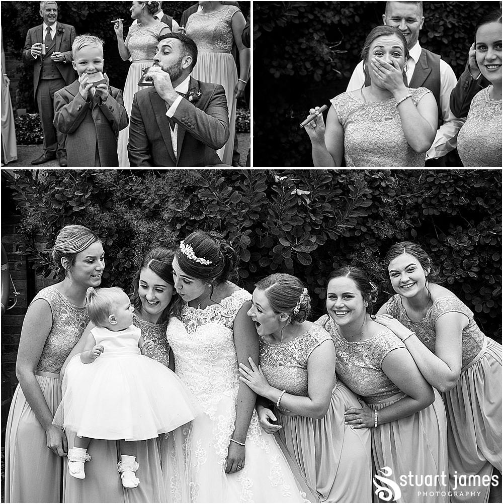 Cigar fun with the wedding party at The Moat House by Stafford Wedding Photographers Stuart James