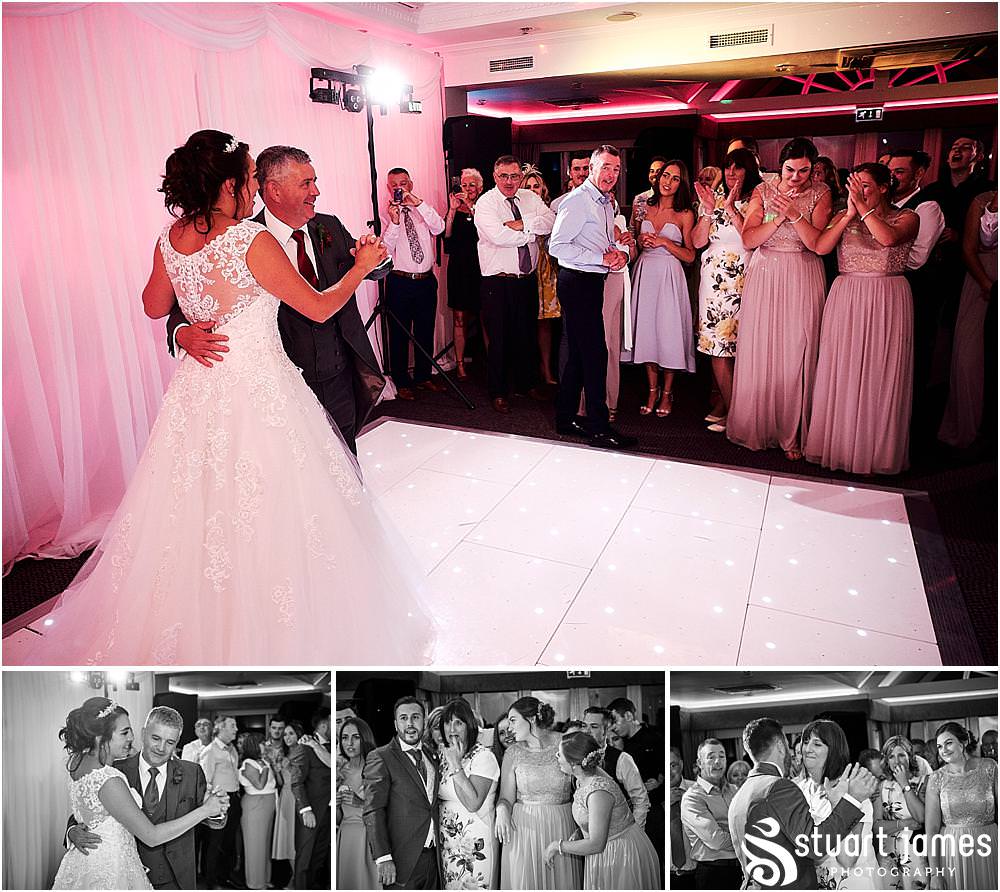 Emotional moments as the father daughter dance proceeds the first dance at The Moat House by Stafford Wedding Photographers Stuart James