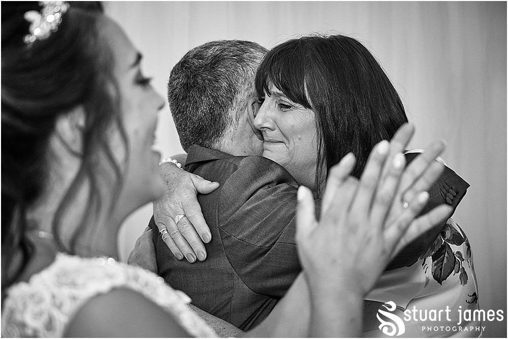 Emotional moments as the father daughter dance proceeds the first dance at The Moat House by Stafford Wedding Photographers Stuart James
