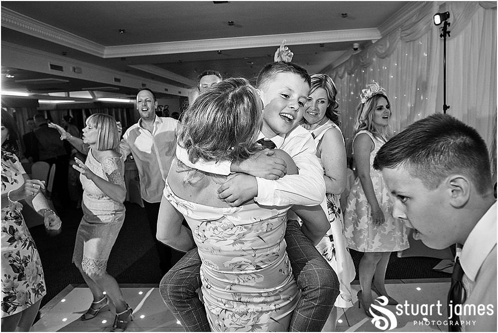 Capturing the life of the party as the wedding party get straight into having the best night at The Moat House by Stafford Wedding Photographers Stuart James