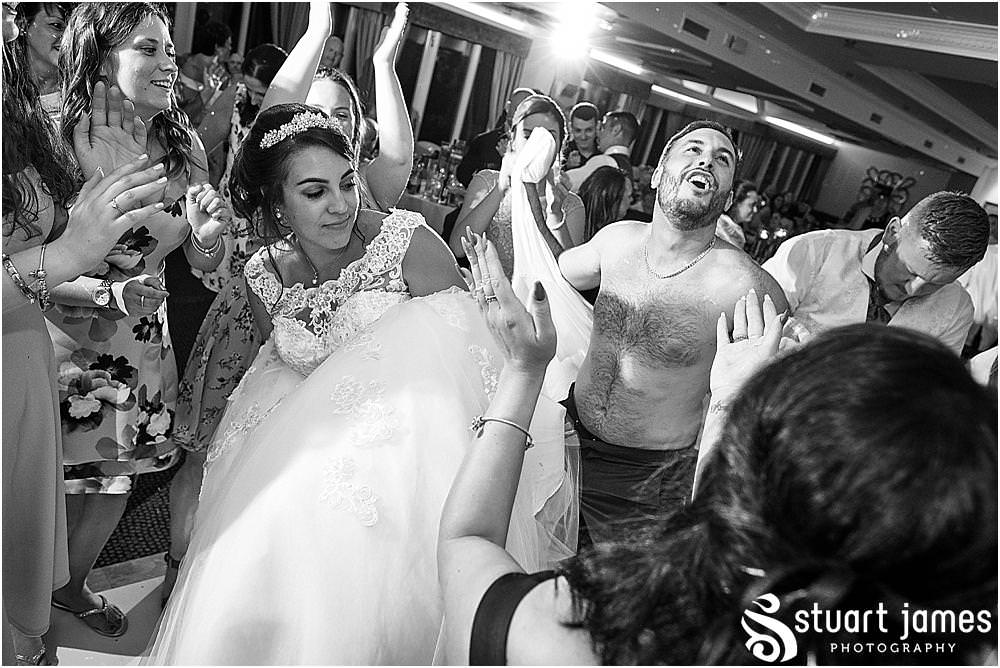 Capturing the life of the party as the wedding party get straight into having the best night at The Moat House by Stafford Wedding Photographers Stuart James