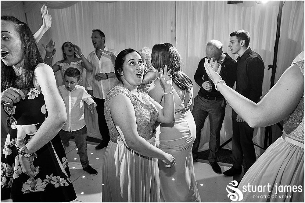 One wild and fun party with photographs capturing the real spirit and excitement of the wedding at The Moat House by Stafford Wedding Photographers Stuart James
