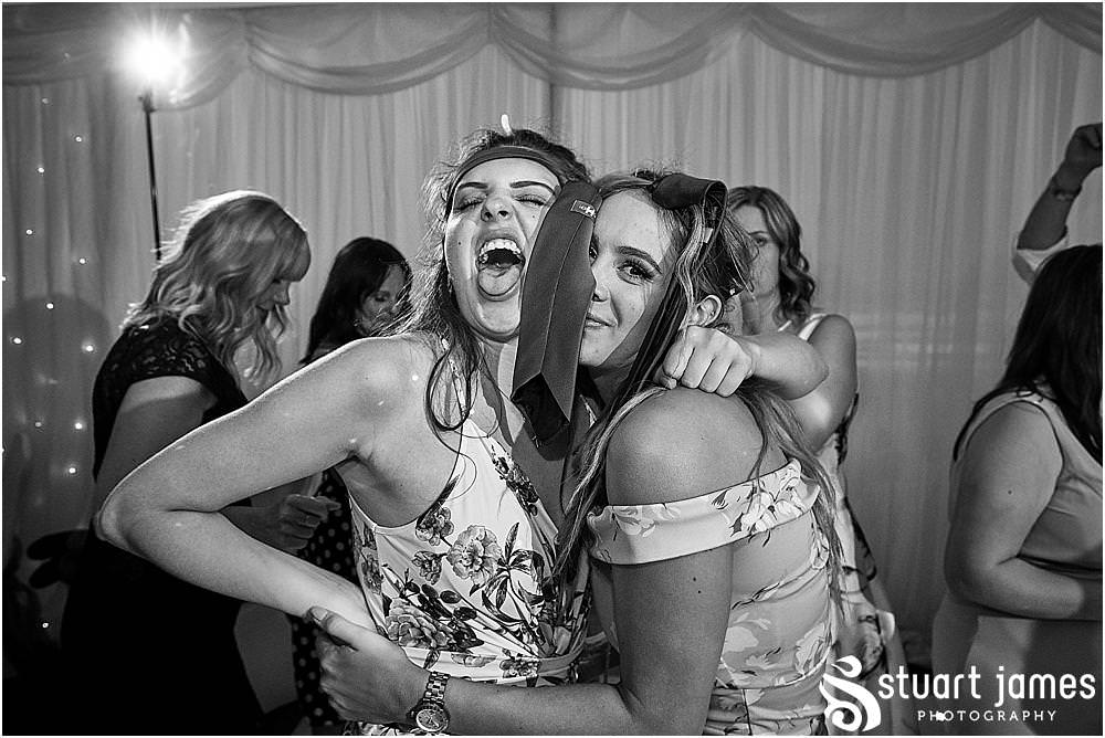 One wild and fun party with photographs capturing the real spirit and excitement of the wedding at The Moat House by Stafford Wedding Photographers Stuart James