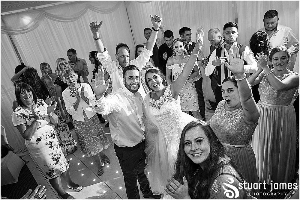 Amazing night photography showing the real energy and excitement of the wedding party at The Moat House by Stafford Wedding Photographers Stuart James