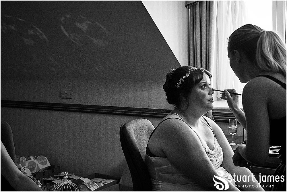Candid photos of the bridal prep ahead of the wedding at Windmill Village in Coventry by Windmill Village Wedding Photographer Stuart James