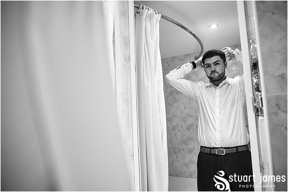 Such exciting moments as the details all come together during the preparations of the groom and best men at Windmill Village in Coventry by Windmill Village Wedding Photographer Stuart James