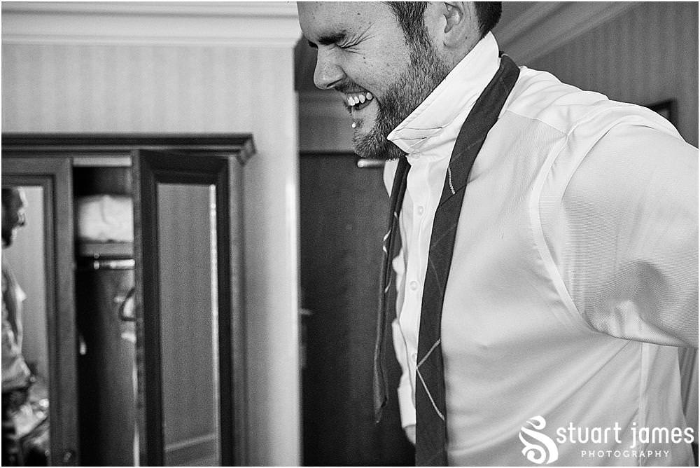 Capturing the mood building for the groom and groomsmen at Windmill Village in Coventry by Windmill Village Wedding Photographer Stuart James