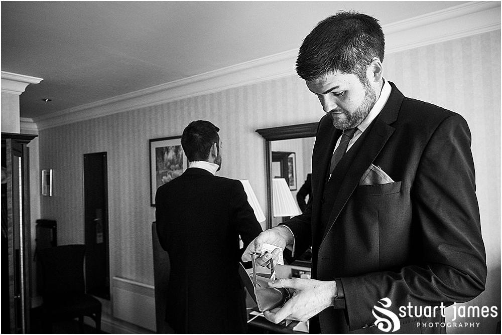 Such exciting moments as the details all come together during the preparations of the groom and best men at Windmill Village in Coventry by Windmill Village Wedding Photographer Stuart James
