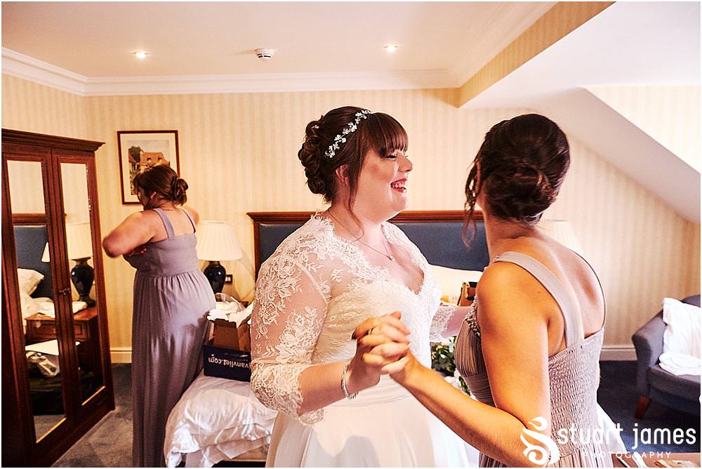 Creative photos capturing the mood and telling the story as it all comes together with our bride dressed in her stunning gown ready for the wedding at Windmill Village in Coventry by Windmill Village Wedding Photographer Stuart James