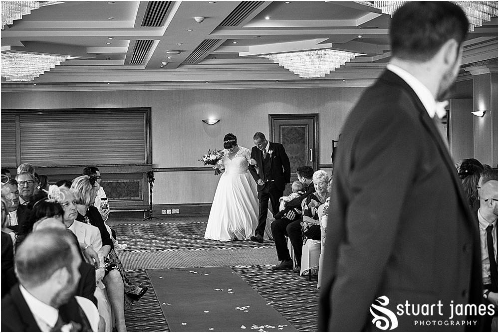 Unobtrusive photography and videography documenting the entrance of our bridal party into the ceremony at Windmill Village in Coventry by Windmill Village Wedding Photographer Stuart James