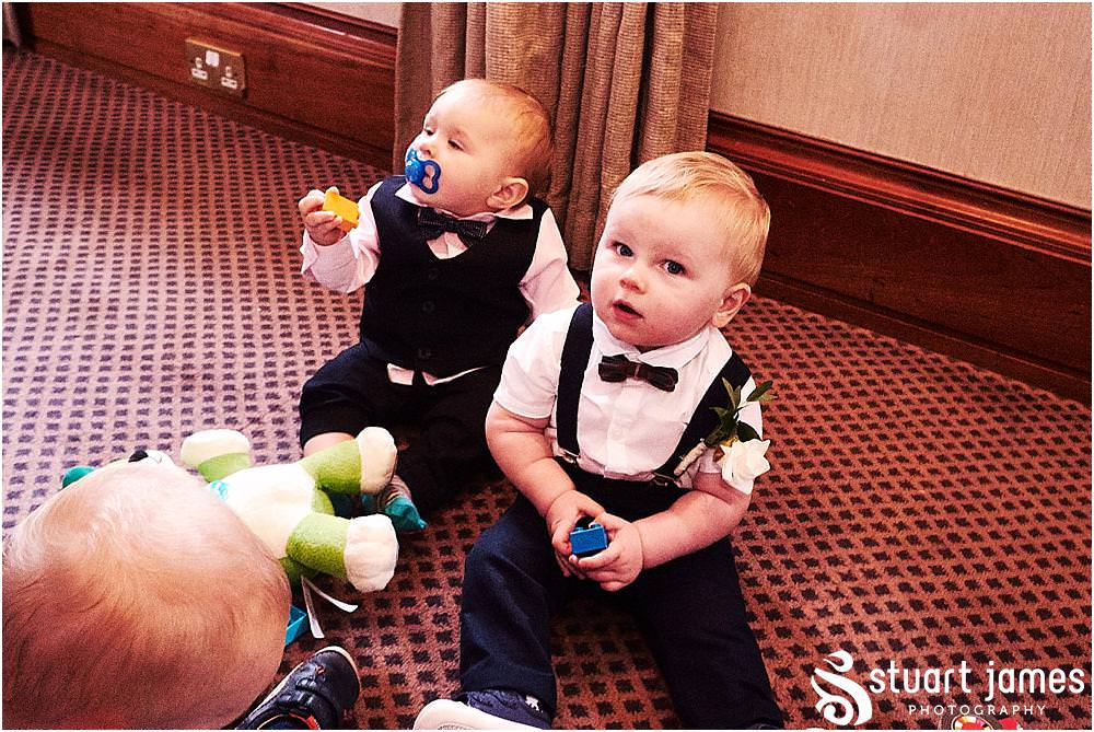 Candid photographs of the guests enjoying the drinks reception at Windmill Village in Coventry by Windmill Village Wedding Photographer Stuart James