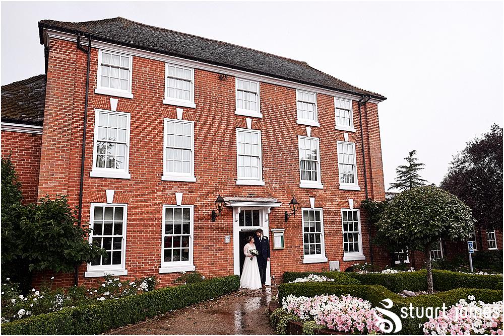Creative relaxed portraits of our bride and groom ahead of the wedding breakfast at Windmill Village in Coventry by Windmill Village Wedding Photographer Stuart James