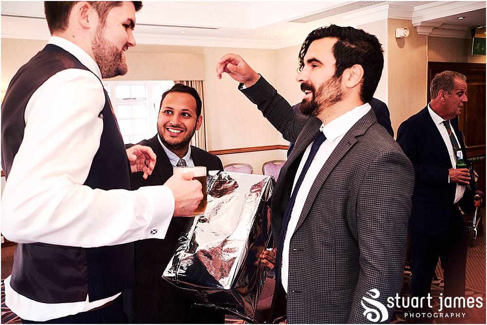 Creative candid photos as the guests enjoy the evening reception at Windmill Village in Coventry by Windmill Village Wedding Photographer Stuart James