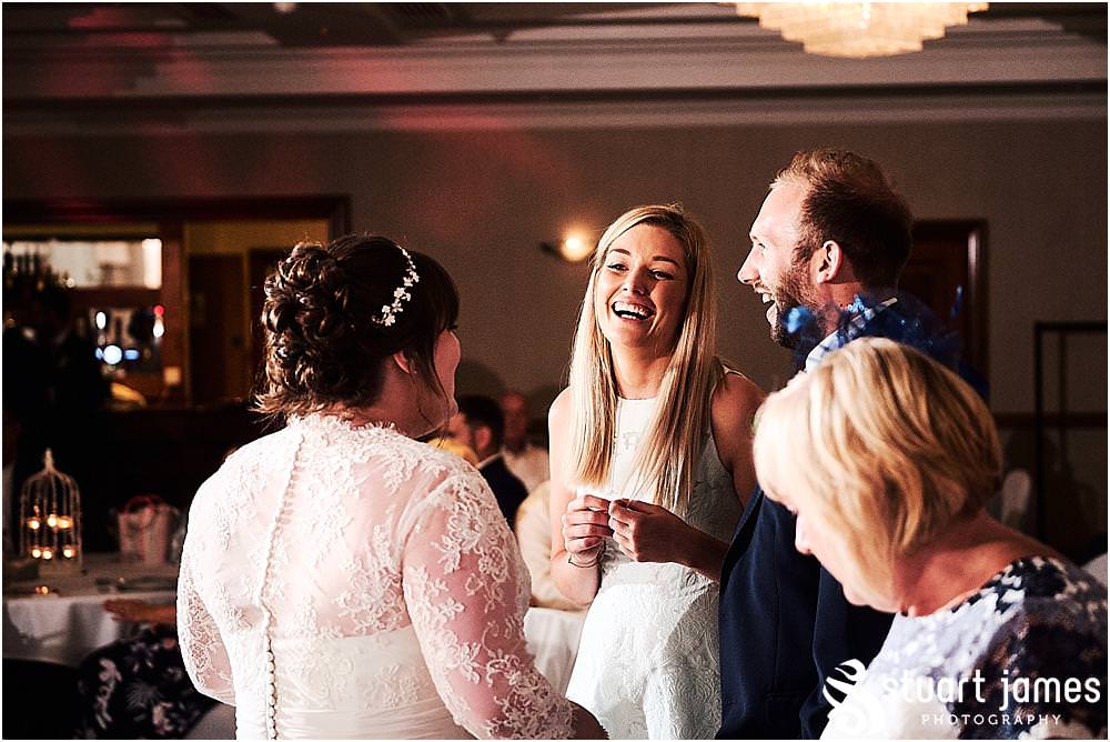 Creative candid photos as the guests enjoy the evening reception at Windmill Village in Coventry by Windmill Village Wedding Photographer Stuart James