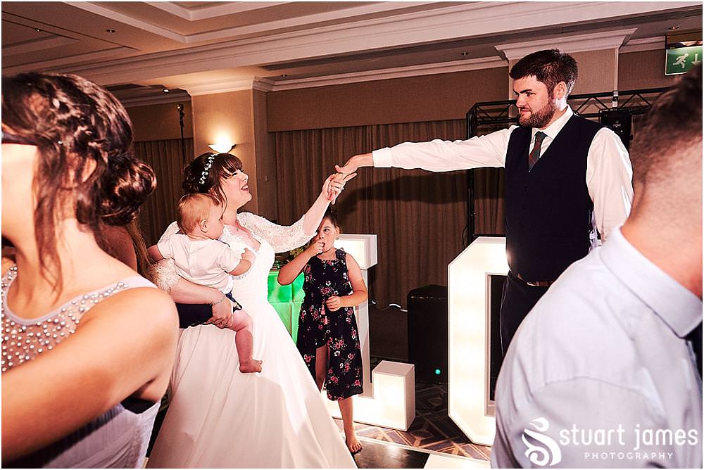 Creative photos capturing the spirit of the night as the guests have the best time partying with the new Mr & Mrs at Windmill Village in Coventry by Windmill Village Wedding Photographer Stuart James
