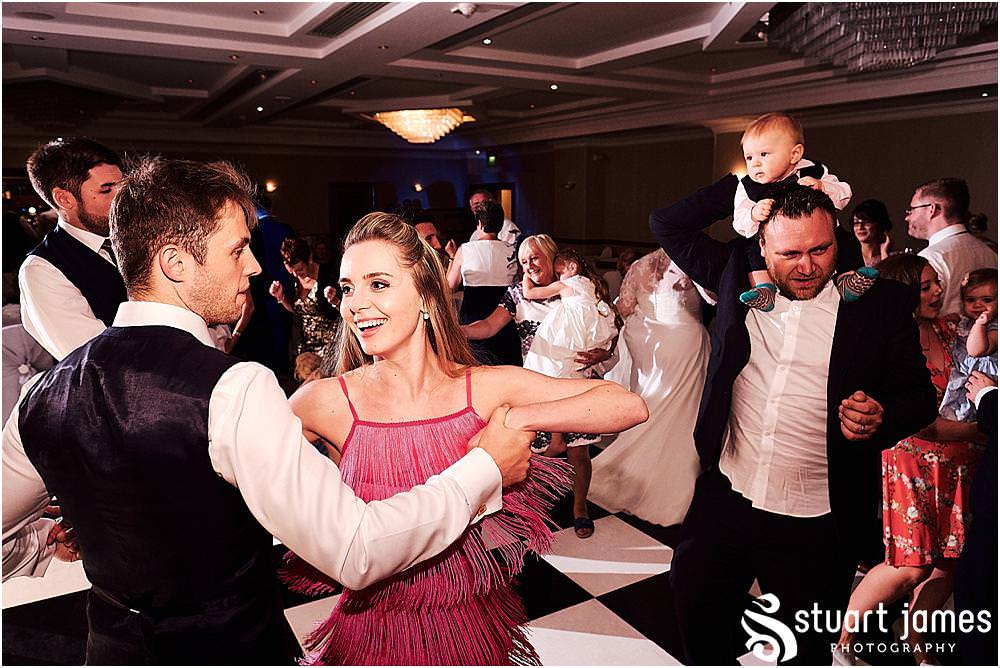Creative photos capturing the spirit of the night as the guests have the best time partying with the new Mr & Mrs at Windmill Village in Coventry by Windmill Village Wedding Photographer Stuart James