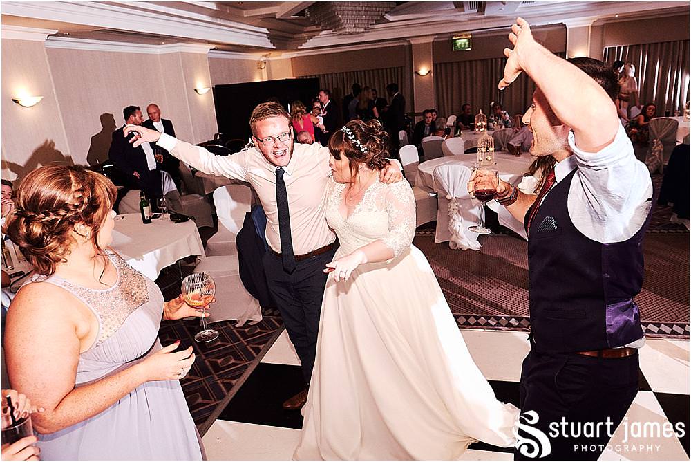 Creative photos capturing the spirit of the night as the guests have the best time partying with the new Mr & Mrs at Windmill Village in Coventry by Windmill Village Wedding Photographer Stuart James