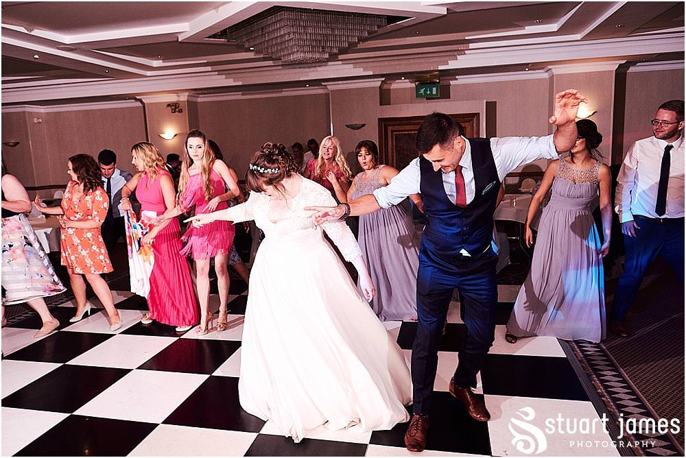 Creative photos capturing the spirit of the night as the guests have the best time partying with the new Mr & Mrs at Windmill Village in Coventry by Windmill Village Wedding Photographer Stuart James