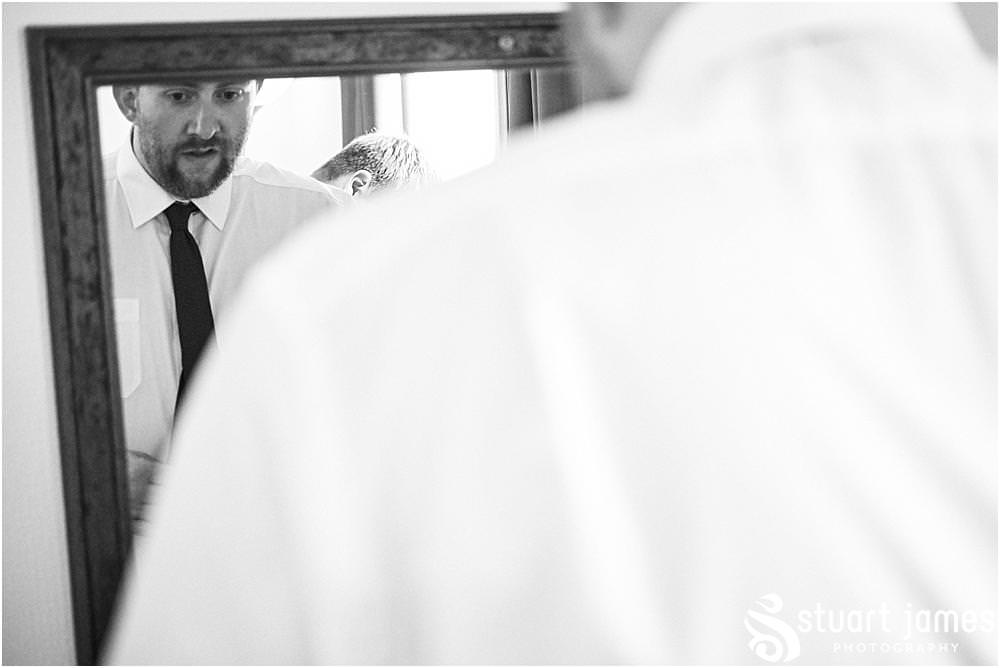 Capturing the relaxed preparations of the grooms party as they get ready for the wedding at Oak Farm Hotel in Cannock - Oak Farm Wedding Photographs by Stuart James