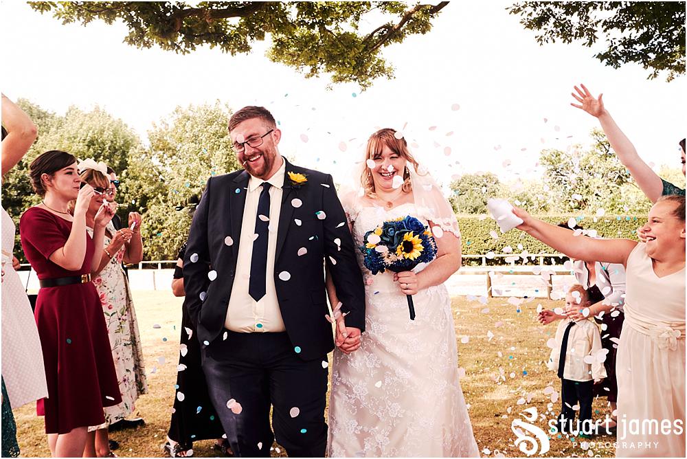 Candid photos of the guests enjoying the wedding reception in the garden at Oak Farm Hotel in Cannock - Oak Farm Wedding Photographs by Stuart James