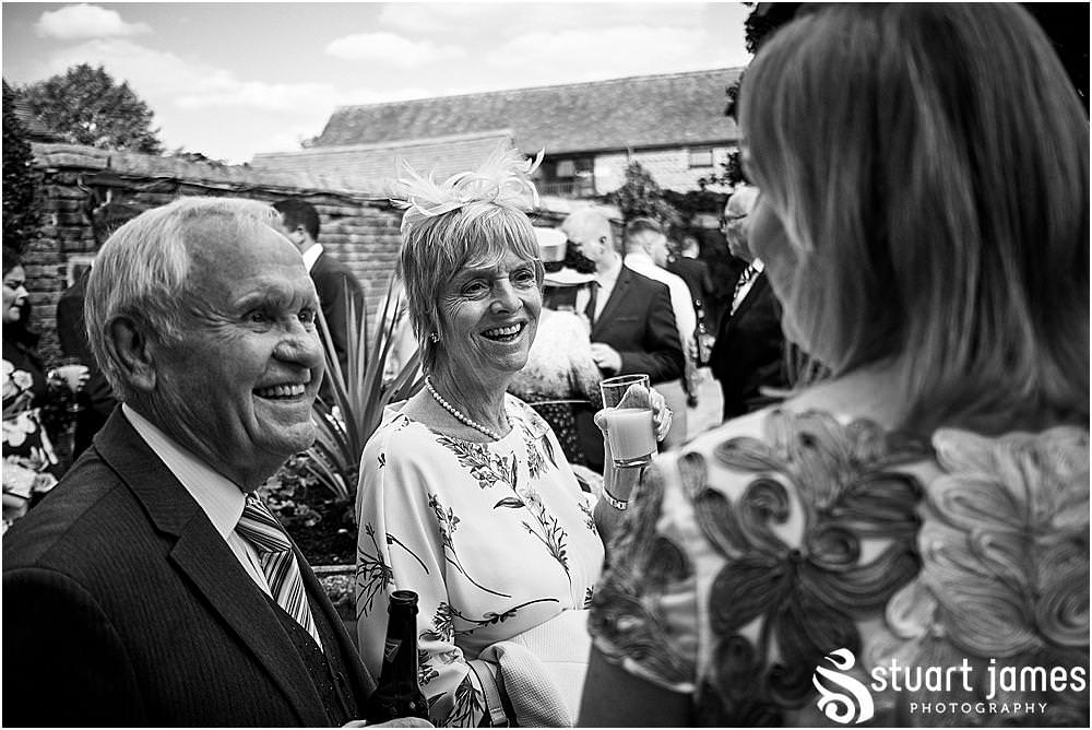 Capturing natural fun moments as the guests enjoy the drinks reception at Blakelands in Stourbridge by Documentary Wedding Photographer Stuart James
