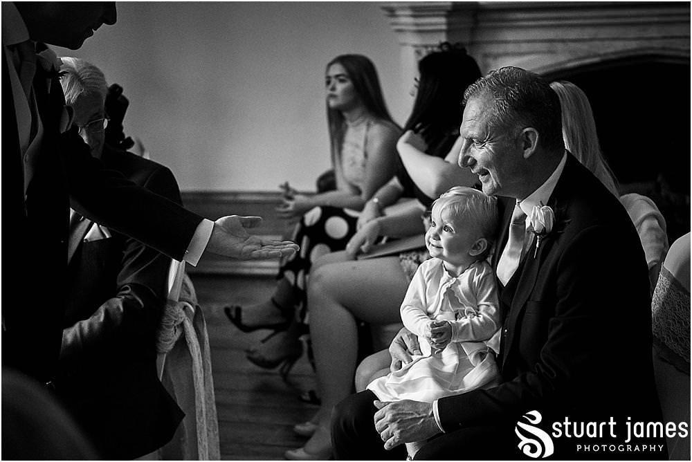 Relaxed photos capturing the groom greeting the guests for the wedding at Hawkesyard Estate - Hawkesyard Wedding Photographs by Stuart James