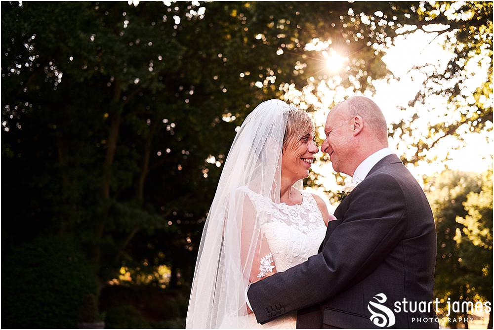 Creative elegant portraits of the bride and groom during the stunning evening light at Hawkesyard Estate - Hawkesyard Wedding Photographs by Stuart James