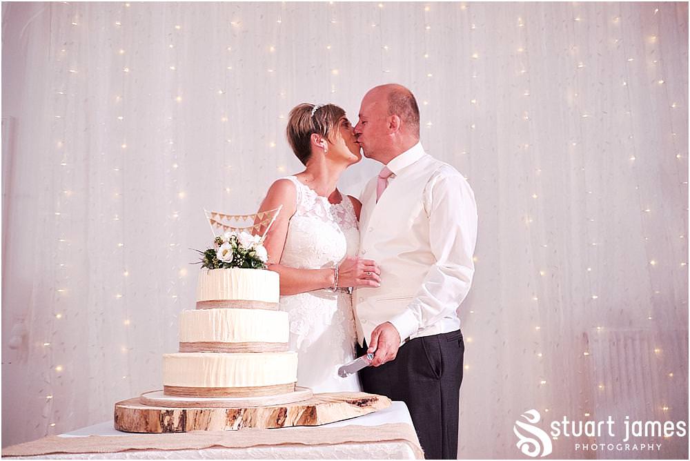 Cake cutting fun at Hawkesyard Estate - Hawkesyard Wedding Photographs by Stuart James