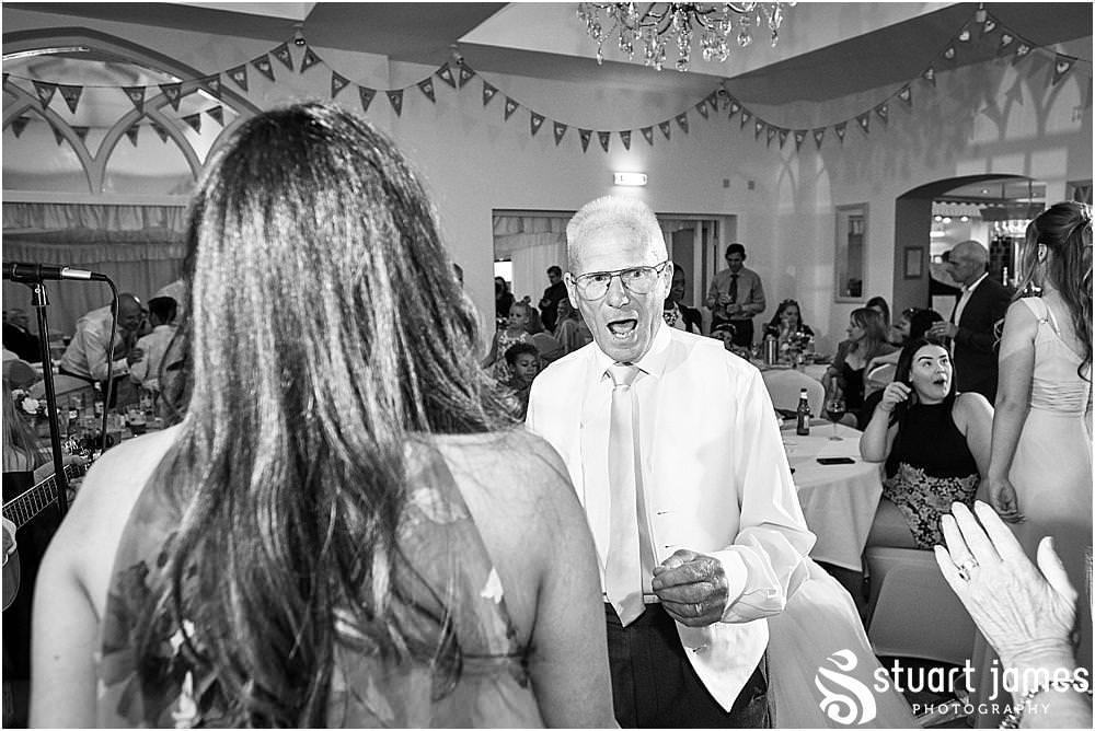 Capturing the fun of the evening as the guests are entertained with amazing music from Mikey Gormley at Hawkesyard Estate - Hawkesyard Wedding Photographs by Stuart James