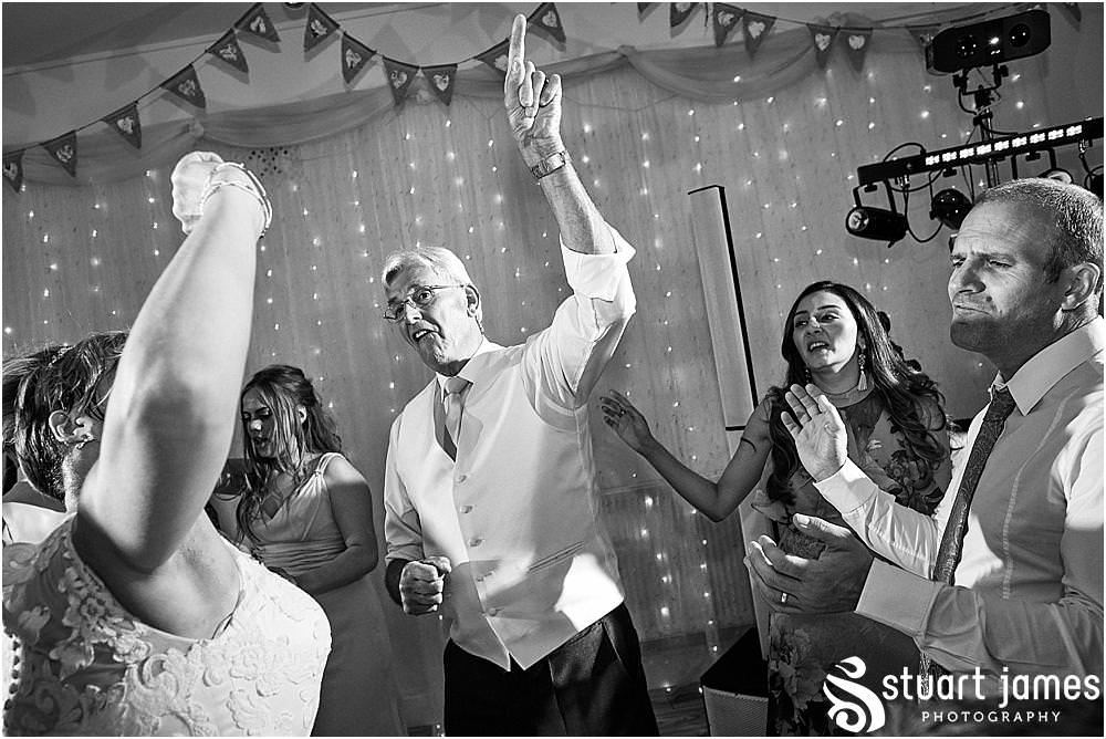 Capturing the fun of the evening as the guests are entertained with amazing music from Mikey Gormley at Hawkesyard Estate - Hawkesyard Wedding Photographs by Stuart James