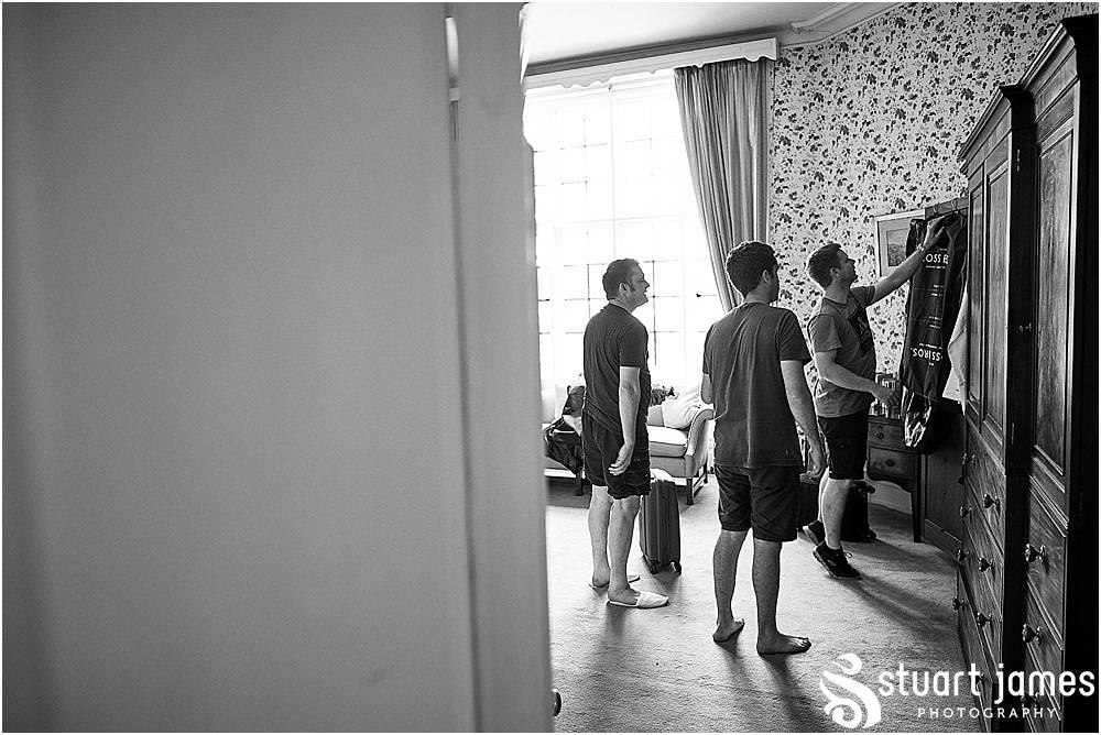 Unobtrusive moments captured with the grooms preparations at Heath House in Tean by Heath House Wedding Photographers Stuart James