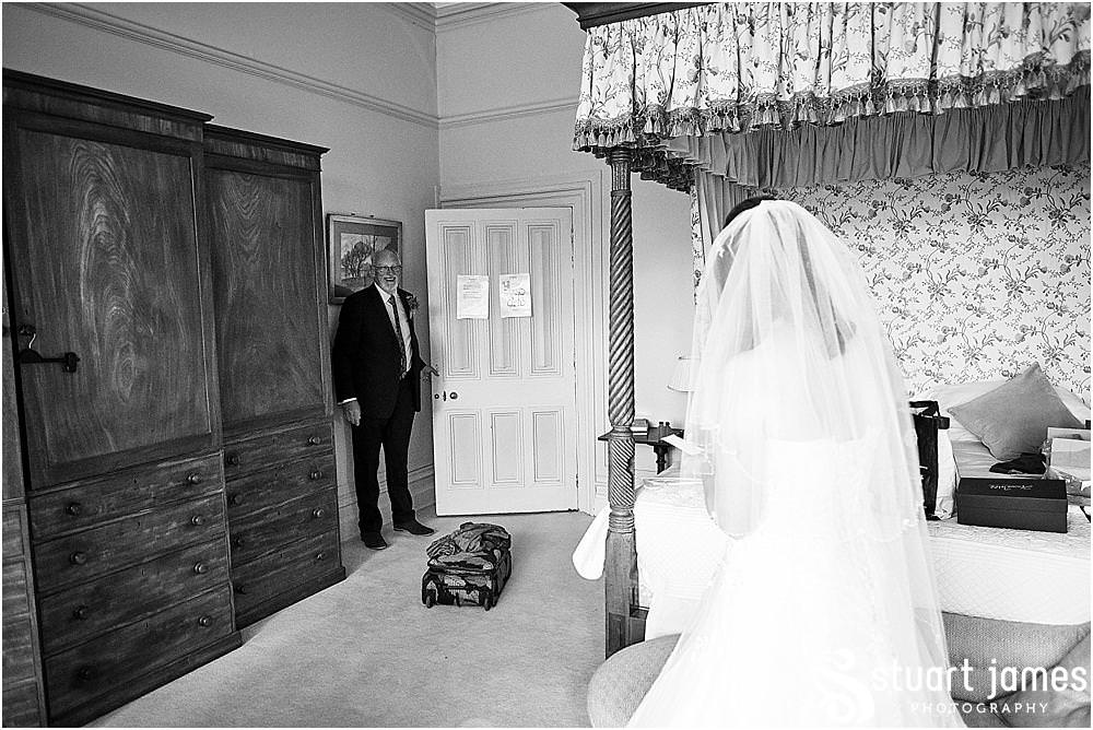 The most beautiful moment to capture as the Father of the Bride sees his beautiful daughter radiant and ready for the wedding at Heath House in Tean by Heath House Wedding Photographers Stuart James