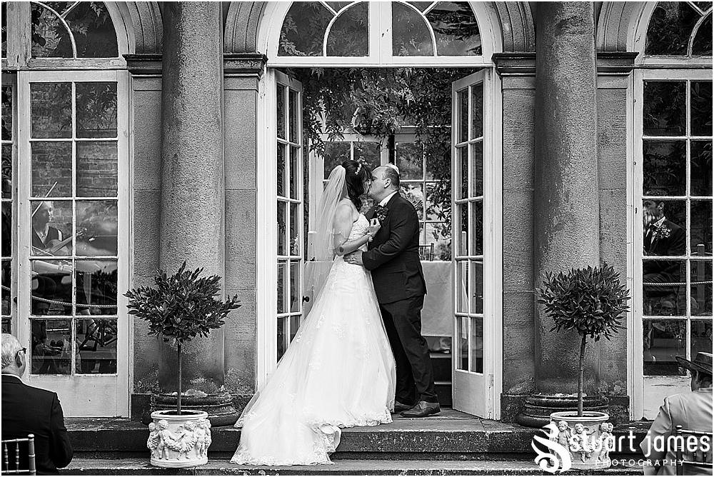 Documenting the beautiful wedding ceremony in the stunning garden at Heath House in Tean by Heath House Wedding Photographers Stuart James