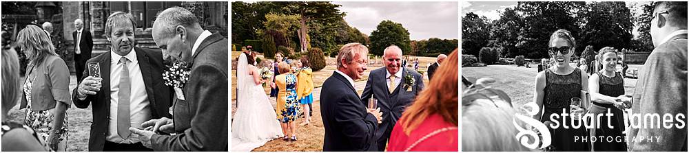 Creative candid moments as the guests greet the bride and groom at Heath House in Tean by Heath House Wedding Photographers Stuart James
