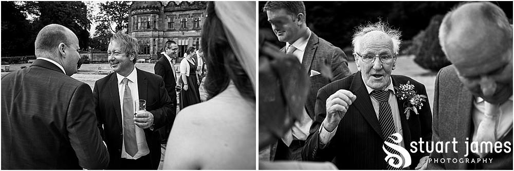 Creative candid moments as the guests greet the bride and groom at Heath House in Tean by Heath House Wedding Photographers Stuart James