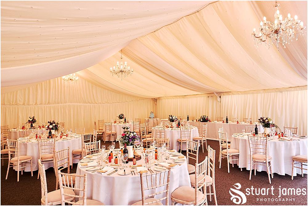 Details of the wedding decor in the marquee for the wedding breakfast at Heath House in Tean by Heath House Wedding Photographers Stuart James